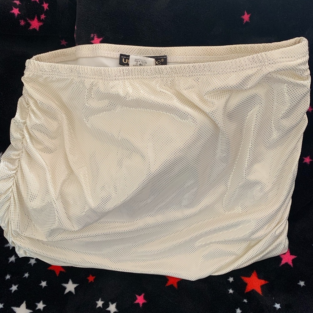 White mini skirt with gold dots